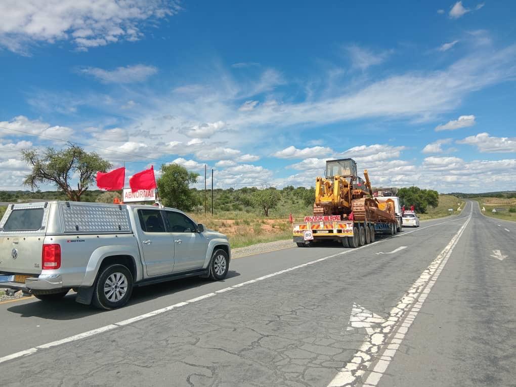 MISGANA abnormal load convoy with escort vehicles on SADC open road