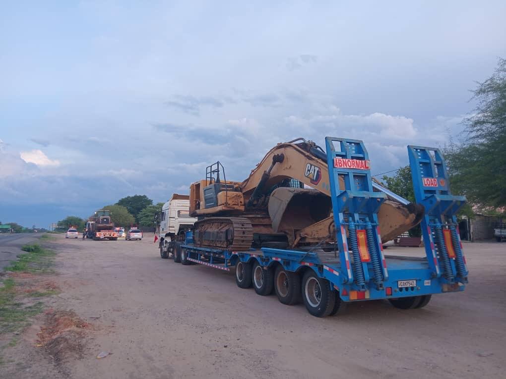MISGANA abnormal load transport — CAT excavator on lowbed across SADC