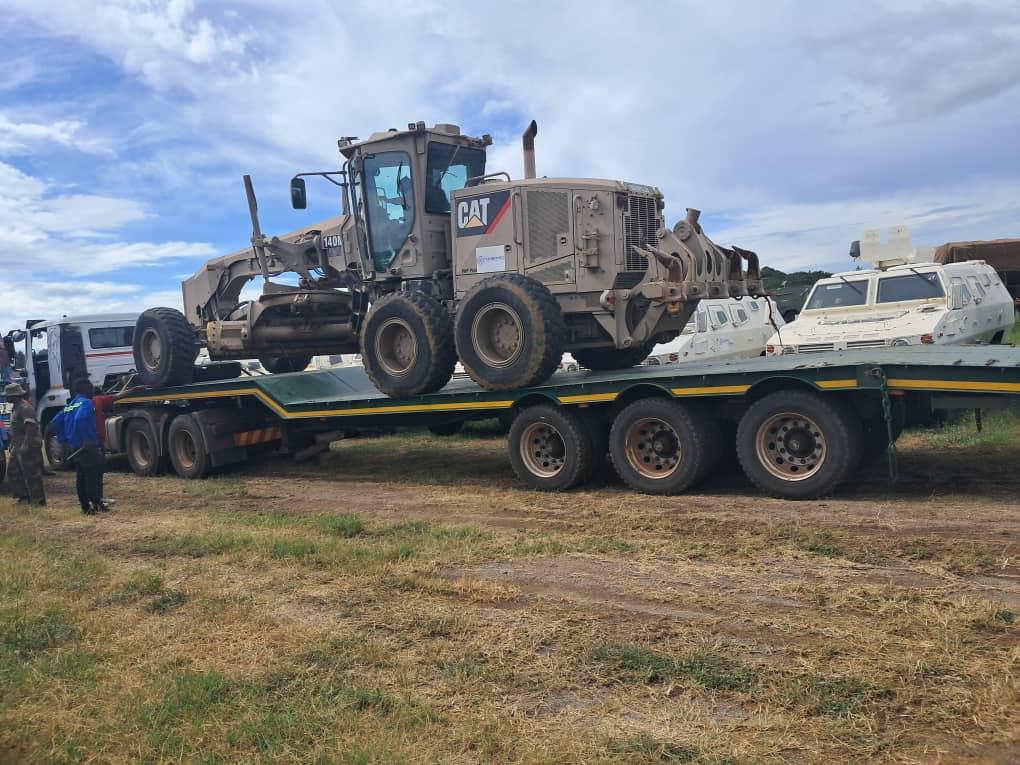 MISGANA transporting CAT 140M grader on lowbed trailer across SADC