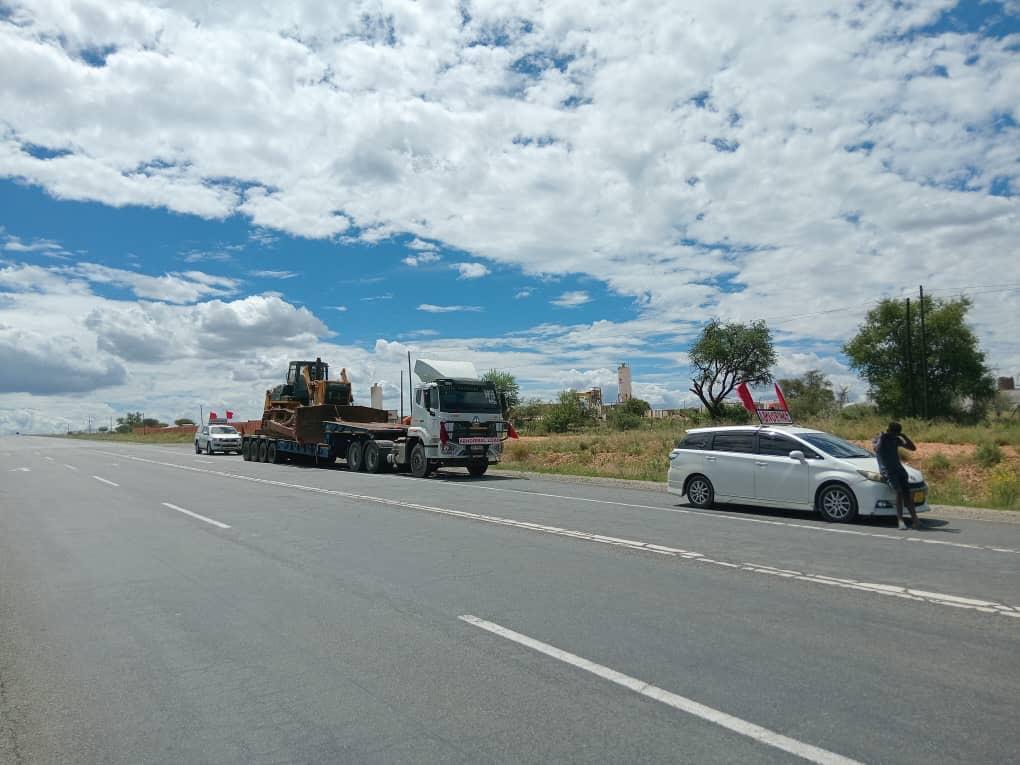 MISGANA heavy haulage abnormal load convoy at sunset across SADC highway